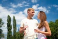 Couple hold water bottles. Water balance concept. Signs you definitely need pay attention body hydration. Sport and Royalty Free Stock Photo