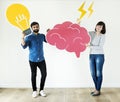 Couple holding brain and light bulb icon