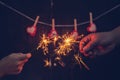 Couple holding a burning sparklers