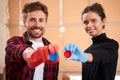 Couple holding caps from plastic bottles Royalty Free Stock Photo