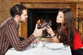 Couple holding glasses of wine and cheers Royalty Free Stock Photo