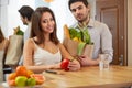 Couple are holding a grossery bag full of vegetables. Healthy Li Royalty Free Stock Photo