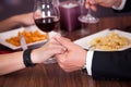 Couple holding hand at restaurant Royalty Free Stock Photo