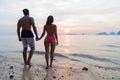 Couple Holding Hands On Beach At Sunset Back Rear View, Young Tourist Man And Woman On Sea Holiday Royalty Free Stock Photo