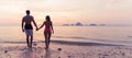 Couple Holding Hands On Beach At Sunset Back Rear View, Young Tourist Man And Woman On Sea Holiday Royalty Free Stock Photo