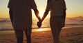 Couple holding hands, beach at sunset and ocean with back view, vacation and travel with man and woman outdoor. Love Royalty Free Stock Photo