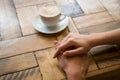 Couple holding hands with coffee cup on table in cafe Royalty Free Stock Photo