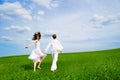 Couple holding hands in a field Royalty Free Stock Photo