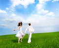 Couple holding hands in a field Royalty Free Stock Photo