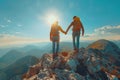 A couple is holding hands on a mountain top Royalty Free Stock Photo