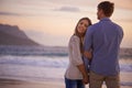 Couple, holding hands and portrait in embrace by water, ocean and peace for romance in relationship. People, love and Royalty Free Stock Photo