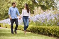 Couple Holding Hands On Romantic Walk In Park Together Royalty Free Stock Photo