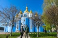 Kiev - A couple admiring St Michael`s Golden-Domed Cathedral