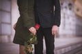 Couple holding hands together with red rose no face Royalty Free Stock Photo