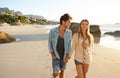 Couple, holding hands and walking at beach, portrait and smile with love, bonding and kindness on vacation. Man, woman Royalty Free Stock Photo