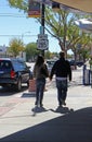 Couple holding hands while walking