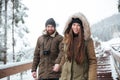 Couple holding hands and walking down the stairs in winter Royalty Free Stock Photo