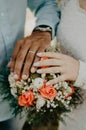 Couple holding handson their wedding day