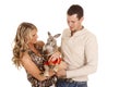 Couple holding kangaroo look at him