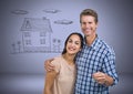Couple Holding key with house drawing in front of vignette Royalty Free Stock Photo