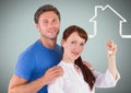 Couple Holding key with house icon in front of vignette Royalty Free Stock Photo