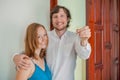 The couple are holding the key to your new home. Real estate concept Royalty Free Stock Photo