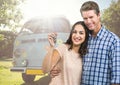 Couple holding keys in front of Camper van Royalty Free Stock Photo