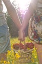 Couple Holding Picnic Basket