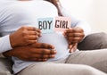 Couple holding pink and blue color card for baby gender