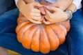 Couple holding a pumpkin