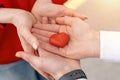 Couple holding red heart. Getting together in love concept