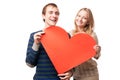 Couple holding sign in form of red heart Royalty Free Stock Photo