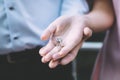 Couple holding a small shiny golden key Royalty Free Stock Photo