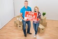 Couple Holding Sold Sign Royalty Free Stock Photo