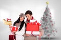 Couple holding stack of christmas gifts Royalty Free Stock Photo