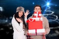 Couple holding stack of christmas gifts Royalty Free Stock Photo