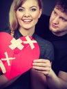 Couple holds broken heart joined in one Royalty Free Stock Photo