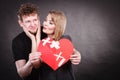 Couple holds broken heart joined in one Royalty Free Stock Photo