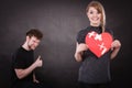 Couple holds broken heart joined in one Royalty Free Stock Photo