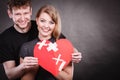 Couple holds broken heart joined in one Royalty Free Stock Photo