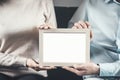 the couple holds frame photo