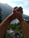 Couple holds hands together on the background