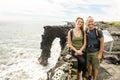 A Couple at the Holei Sea Arch, Hawaii Volcanoes National Park Royalty Free Stock Photo