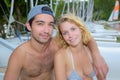 Couple on holiday posing for camara on boat