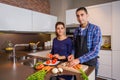 Couple in home kitchen prepairing healthy food