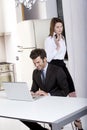 Couple at home with laptop and mobile Royalty Free Stock Photo