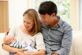 Couple at home with new baby Royalty Free Stock Photo