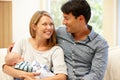 Couple at home with new baby Royalty Free Stock Photo