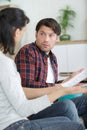 couple at home questioning document Royalty Free Stock Photo