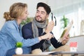 couple at home reading pamphlet